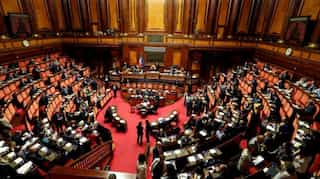 Italy government wins a confidence vote on decree targeting migrant rescue ships