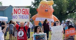 Trump visits victims of mass shootings at El Paso as protesters shout 'Do something!'