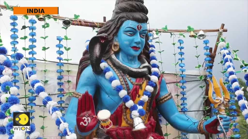 Saffron-clad, dope-using Indian pilgrims flood Ganges' plains to honor Shiva