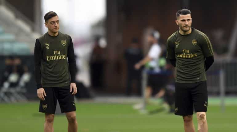 Two charged over security incident linked to Arsenal duo Two charged over security incident linked to Arsenal duo