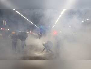 As Hong Kong protesters return to streets for tenth week, riot police fire tears gas into rail station