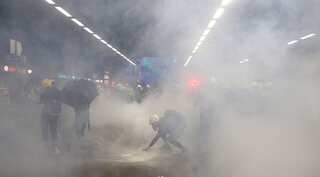 As Hong Kong protesters return to streets for tenth week, riot police fire tears gas into rail station