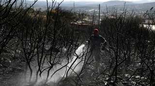 Greek fire crews make progress on island blaze