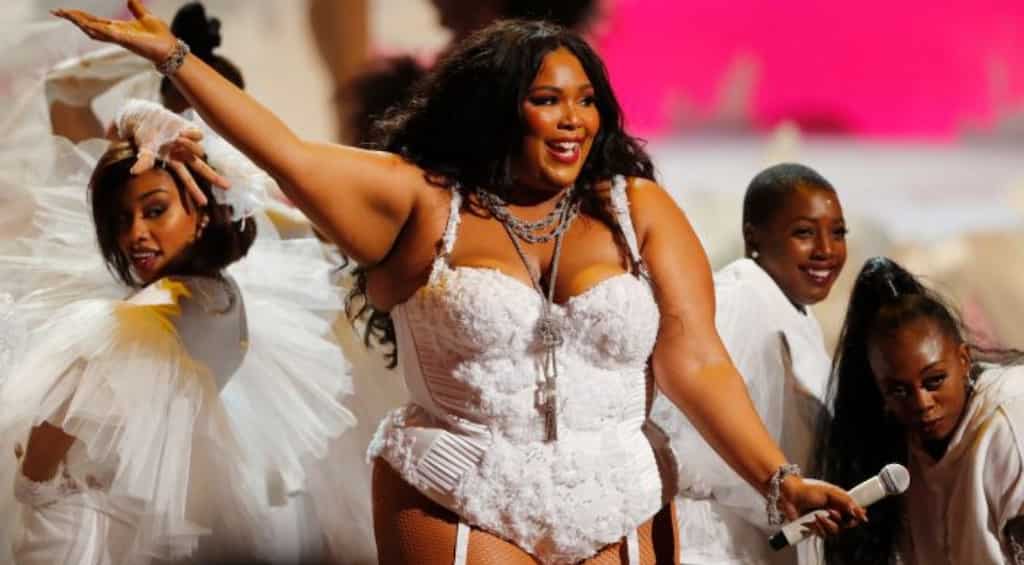 Lizzo channels roll model avatar in red bikini during Brazilian vacation