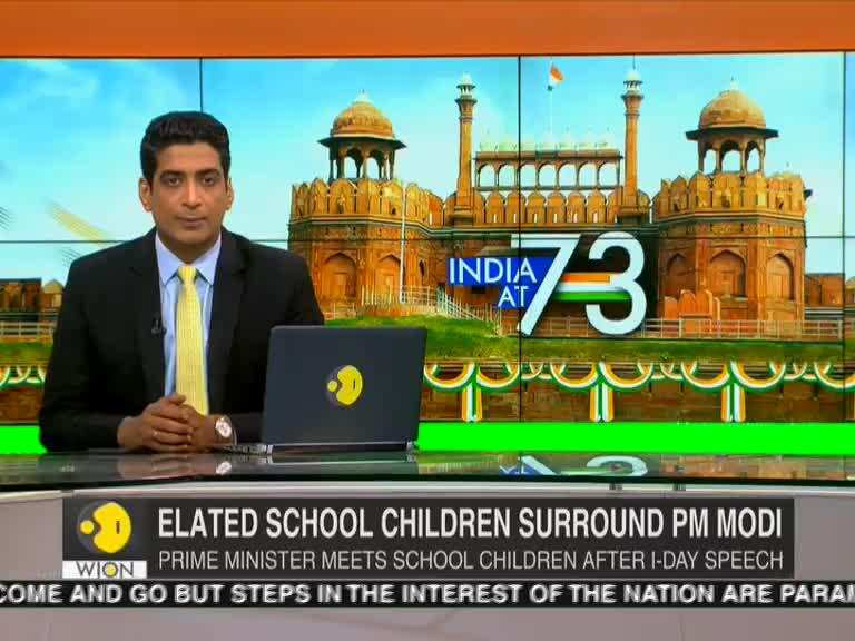Elated school children surrounds PM Modi