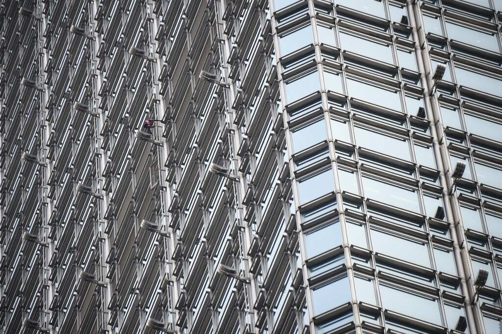 'French Spiderman' scales Hong Kong skyscraper with 'peace banner'