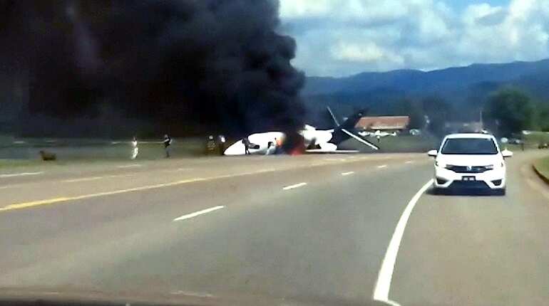 Racing star Earnhardt Jr escapes plane crash