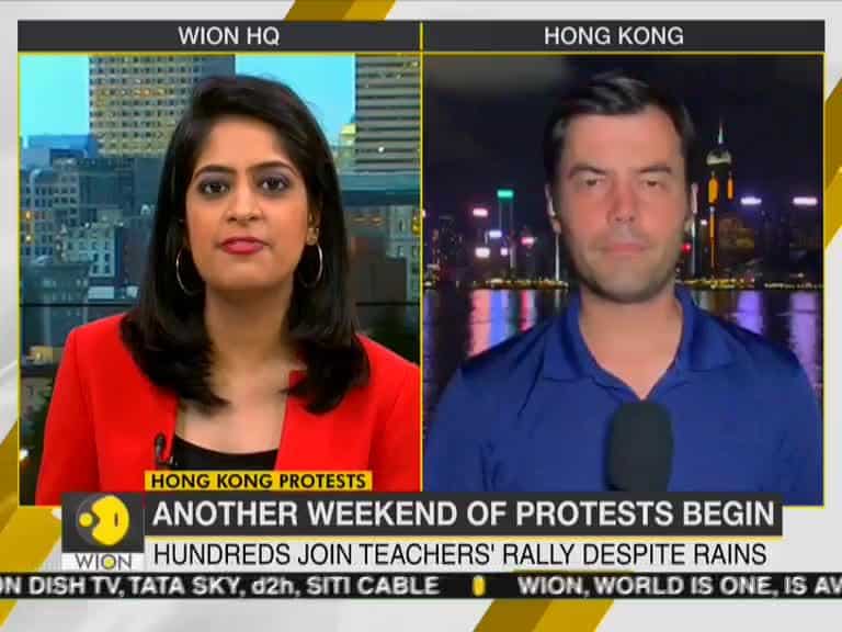 Hong Kong: Hundreds take part in teachers' rally braving downpour