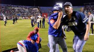 The old grudge between Honduras football fans sparks a riot that kills three