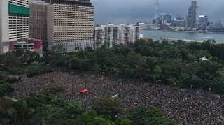 Hong Kong protesters rally to show 'peaceful' credentials after chaos
