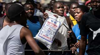 Zimbabwe's dollar plummets 26% as calls to loosen currency controls intensify