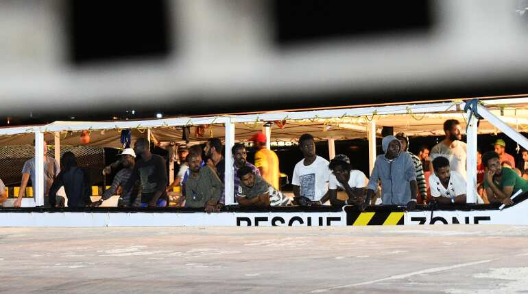 Rescue ship awaits port access in migrant standoff in Mediterranean Rescue ship awaits port access in migrant standoff in Mediterranean