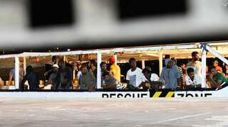Rescue ship awaits port access in migrant standoff in Mediterranean
