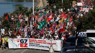 Protesters march near Biarritz demanding action from G7 leaders