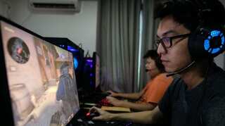 Armed with smartphones, Myanmar e-sports players battle power outages