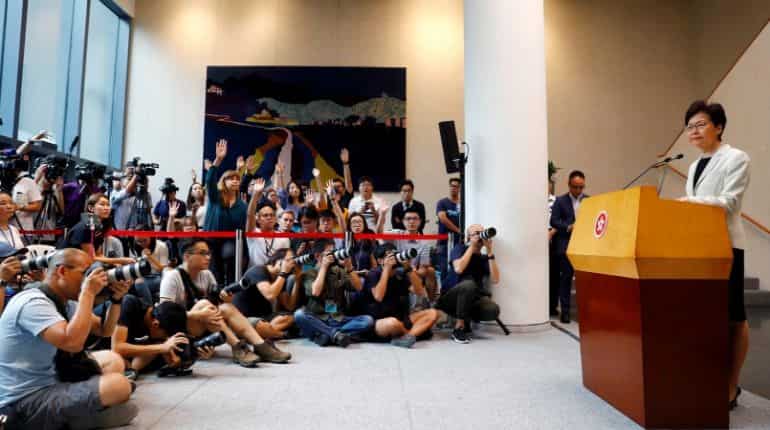 Hong Kong leader says measures announced this week are a 'first step' Hong Kong leader says measures announced this week are a 'first step'