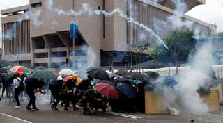 Fire, tear gas, petrol bombs as Hong Kong centre engulfed by chaos