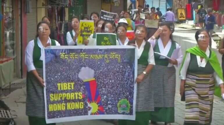 Tibetan women march with eye-patch in support of Hong Kong protestors Tibetan women march with eye-patch in support of Hong Kong protestors