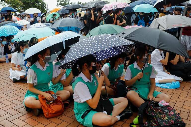Hong Kong students rally peacefully after weekend of protest violence