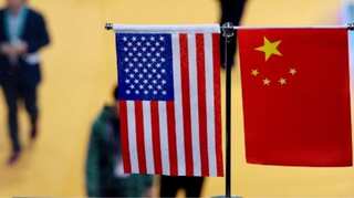 China says hopes to reach phased trade pact with US as early as possible