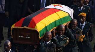 Divided Zimbabwe bids farewell to Robert Mugabe with state funeral