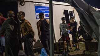 Riots at Greek migrant camp after two die in a fire
