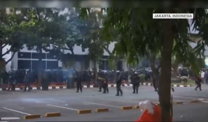 Indonesian police fire tear gas to break up anti-graft, sex-ban law protests