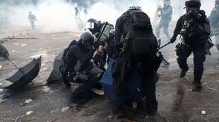 Police shoot Hong Kong protester in chest during clashes
