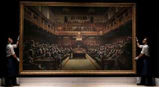 Banksy's UK Parliament painting sells for $12 million after a 13-minute bid