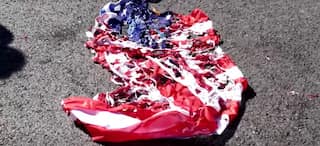 Protesters burn US and NATO flags during Pompeo visit in Athens