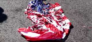 Protesters burn US and NATO flags during Pompeo visit in Athens