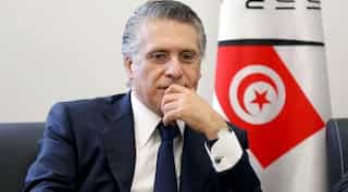 Outsiders battle political elite as Tunisia votes