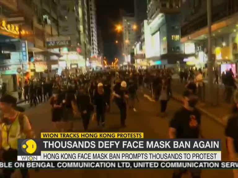 Hong Kong protests: Protesters brave rain to defy face mask ban