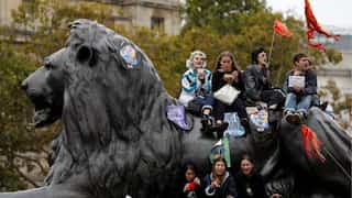 'Sorry, this is an emergency': Climate protesters block streets around the world
