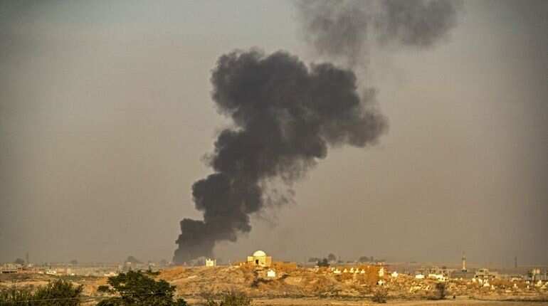 At least 13 dead in car bomb in Syrian border town