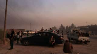 Kurdish fighters, wounded leave besieged Syrian town Ras al-Ain