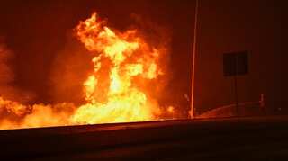Tens of thousands evacuated as California wildfires rage