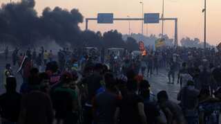 Facing pressure, Baghdad ups probes into protest bloodshed