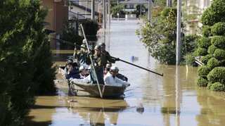 Shinzo Abe visits typhoon-hit areas; Japan may postpone new Emperor's parade