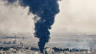 At least 13 dead in car bomb blast in Syria border town