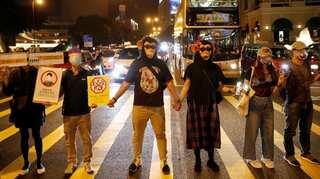 Hong Kong unrest: Democracy crowds defy police after activists attacked