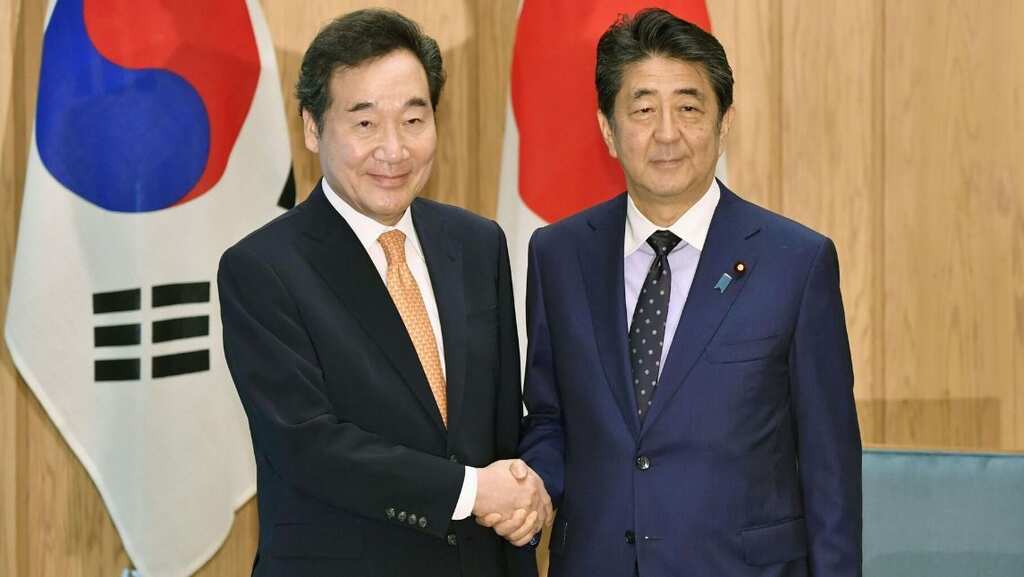 Japan's Shinzo Abe renews call on South Korea to keep promises to mend ties