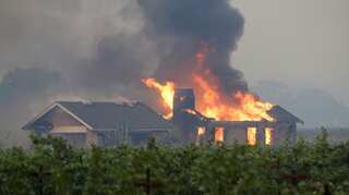 As wildfires rage in California, about 50,000 get evacuated