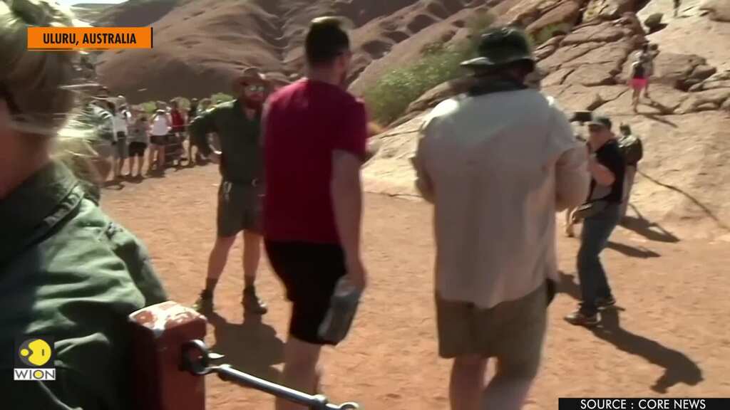 Tourists line up to scale Australia's Uluru hours ahead of climb ban