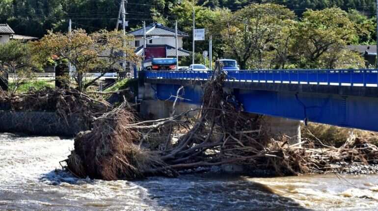 Rescuers hunt for missing people as landslides, floods kill ten in Japan