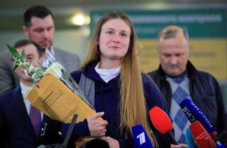 Russian woman convicted by US of being agent returns home