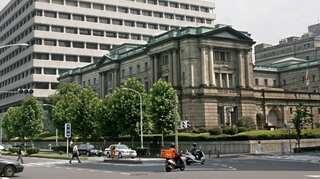 Bank of Japan suggests future rate cut, but holds fire for now