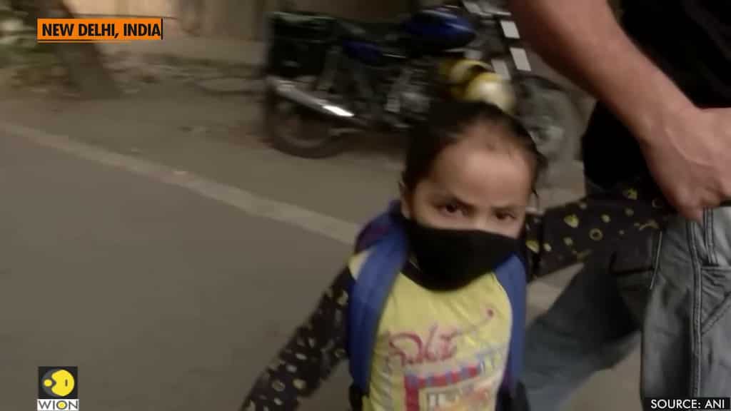 Delhi government distributes masks to children as air quality worsens