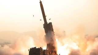 North Korea says it conducted successful test of multiple rocket launchers