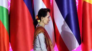 Supporters throng streets as Myanmar leader Suu Kyi returns from The Hague